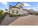 Two-story townhome with a two-car garage and manicured landscaping at 10043 Crooked Creek Dr # 101, Venice, FL 34293