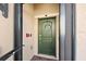 Green front door accented with a stylish wreath at 10043 Crooked Creek Dr # 101, Venice, FL 34293