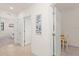 Bright hallway with doors to bedrooms and an office at 10043 Crooked Creek Dr # 101, Venice, FL 34293
