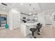 Modern kitchen with island, stainless steel appliances, and white cabinetry at 10043 Crooked Creek Dr # 101, Venice, FL 34293