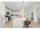 Bright kitchen with an island, stainless steel appliances, and plenty of cabinet storage at 10043 Crooked Creek Dr # 101, Venice, FL 34293