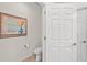 Small powder room with toilet and single sink at 10043 Crooked Creek Dr # 101, Venice, FL 34293