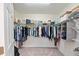 Spacious walk-in closet with ample shelving and hanging space at 10043 Crooked Creek Dr # 101, Venice, FL 34293