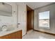 Bathroom with wood vanity and large walk-in shower at 11309 Outrigger Ave, Spring Hill, FL 34608