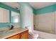 Bathroom with wood vanity, shower, and tile flooring at 11309 Outrigger Ave, Spring Hill, FL 34608