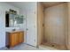 Updated bathroom, featuring a wood vanity and shower at 11309 Outrigger Ave, Spring Hill, FL 34608