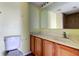 Bathroom features wood cabinets and a shower/tub combo at 11309 Outrigger Ave, Spring Hill, FL 34608