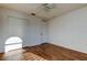 Well-lit bedroom with wood floors and double-door closet at 11309 Outrigger Ave, Spring Hill, FL 34608