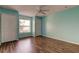 Bedroom with wood flooring, a ceiling fan and window at 11309 Outrigger Ave, Spring Hill, FL 34608
