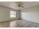 Spacious bedroom with tile flooring and ceiling fan at 11309 Outrigger Ave, Spring Hill, FL 34608