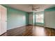 Spacious bedroom with ceiling fan and wood floors at 11309 Outrigger Ave, Spring Hill, FL 34608