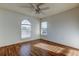 Bright bedroom featuring wood floors and a large arched window at 11309 Outrigger Ave, Spring Hill, FL 34608