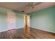 Bedroom with hardwood floors and access to other rooms at 11309 Outrigger Ave, Spring Hill, FL 34608