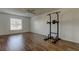 Bedroom with hardwood floors and home gym at 11309 Outrigger Ave, Spring Hill, FL 34608