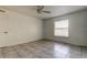 Bright bedroom with tile flooring and ceiling fan at 11309 Outrigger Ave, Spring Hill, FL 34608