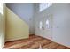 Elegant entryway with double doors and hardwood floors at 11309 Outrigger Ave, Spring Hill, FL 34608