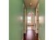 Light and airy hallway with wood flooring and arched doorway at 11309 Outrigger Ave, Spring Hill, FL 34608