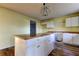 Kitchen island with butcher block countertops and white cabinets at 11309 Outrigger Ave, Spring Hill, FL 34608