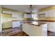 Modern kitchen with white cabinets, wood countertops, and island at 11309 Outrigger Ave, Spring Hill, FL 34608