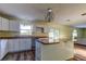 Updated kitchen with island, white cabinets, and wood countertops at 11309 Outrigger Ave, Spring Hill, FL 34608