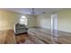Living room with hardwood floors, neutral walls, and a comfy sofa at 11309 Outrigger Ave, Spring Hill, FL 34608