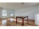 Spacious living area with hardwood floors and arched windows at 11309 Outrigger Ave, Spring Hill, FL 34608