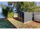 Black metal storage shed in backyard at 11309 Outrigger Ave, Spring Hill, FL 34608
