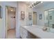 Double vanity bathroom with granite countertop at 17980 Gulf Blvd # 103, Redington Shores, FL 33708