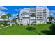 Modern building with a lush green lawn at 17980 Gulf Blvd # 103, Redington Shores, FL 33708