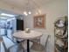 Charming coastal-themed dining area with round table and chairs at 17980 Gulf Blvd # 103, Redington Shores, FL 33708