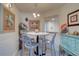 Cozy dining area with round table and four chairs at 17980 Gulf Blvd # 103, Redington Shores, FL 33708