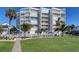 Coastal condo building with pool and lush landscaping at 17980 Gulf Blvd # 103, Redington Shores, FL 33708