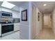 Bright kitchen with stainless steel appliances and ample cabinetry at 17980 Gulf Blvd # 103, Redington Shores, FL 33708