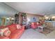 Relaxing living room with coastal decor and tile floors at 17980 Gulf Blvd # 103, Redington Shores, FL 33708