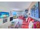 Cozy living room with water views and a decorative fireplace, creating a relaxing atmosphere at 17980 Gulf Blvd # 103, Redington Shores, FL 33708