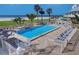 Relaxing community pool with lounge chairs and easy beach access offering an idyllic coastal living experience at 17980 Gulf Blvd # 103, Redington Shores, FL 33708