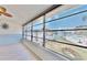 Sunroom offers a relaxing view of the water and community pool at 1898 Shore Dr S # 317, South Pasadena, FL 33707
