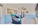 Sunroom with relaxing view, ceiling fan, and comfortable seating at 1898 Shore Dr S # 317, South Pasadena, FL 33707