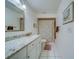 Updated bathroom with granite countertop, shower, and tiled floor at 2035 Nash Dr, Clearwater, FL 33763