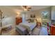 Guest bedroom with a queen-size bed and ample natural light at 2035 Nash Dr, Clearwater, FL 33763