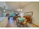 Charming dining room with a four-person table and view into living room at 2035 Nash Dr, Clearwater, FL 33763