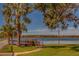 Community boardwalk leads to a peaceful lake view at 2035 Nash Dr, Clearwater, FL 33763
