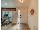 Light and airy entryway with a white door and wood-look floors at 2035 Nash Dr, Clearwater, FL 33763