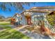 Well-maintained villa with a red door, walkway, and landscaping at 2035 Nash Dr, Clearwater, FL 33763