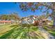 Side view of a villa showcasing its landscaping and walkway at 2035 Nash Dr, Clearwater, FL 33763