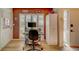 Bright home office features built-in shelving and wood-look flooring at 2035 Nash Dr, Clearwater, FL 33763