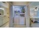 Convenient laundry closet with washer, dryer, and storage shelves at 2035 Nash Dr, Clearwater, FL 33763