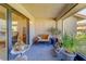 Relaxing screened porch with seating and potted plants at 2035 Nash Dr, Clearwater, FL 33763