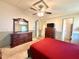 Comfortable bedroom features neutral walls, a ceiling fan, and two matching wood dressers at 225 N Saint Thomas Cir, Apollo Beach, FL 33572