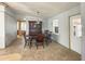 Dining room with light blue walls, decorative hutch, chandelier, and wood dining table at 225 N Saint Thomas Cir, Apollo Beach, FL 33572
